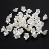 A pile of 100 white acrylic pearl spacer beads for jewelry making
