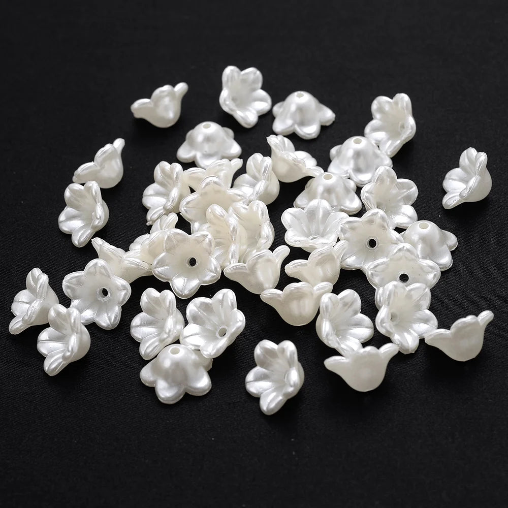 A pile of 100 white acrylic pearl spacer beads for jewelry making
