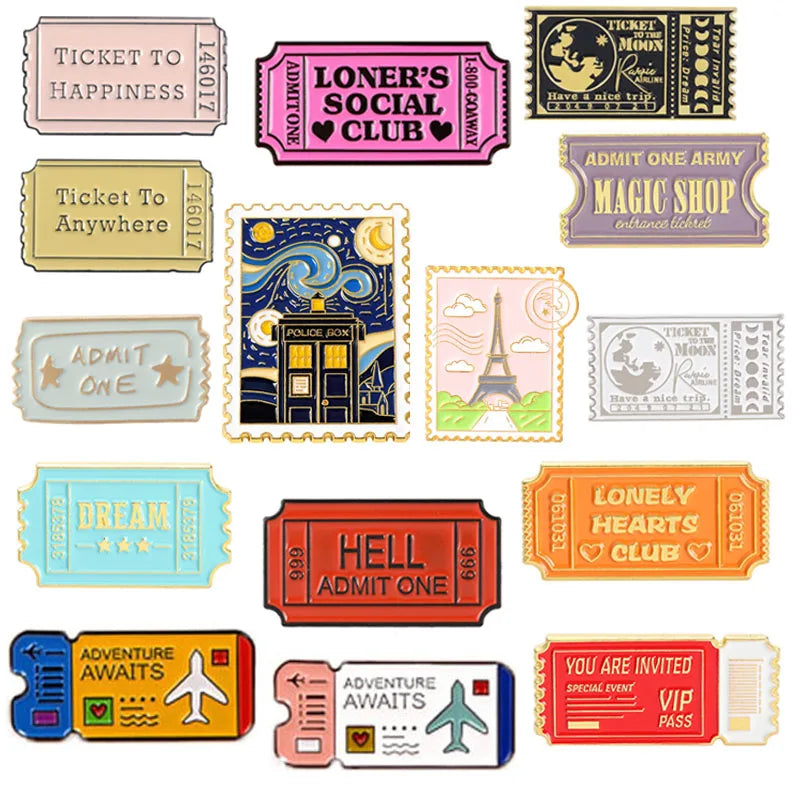 A collection of vintage enamel brooches featuring various themed tickets and badges like ticket to happiness, magic shop, and