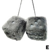 A pair of gray plush velvet dice car mirror pendants hanging by strings.