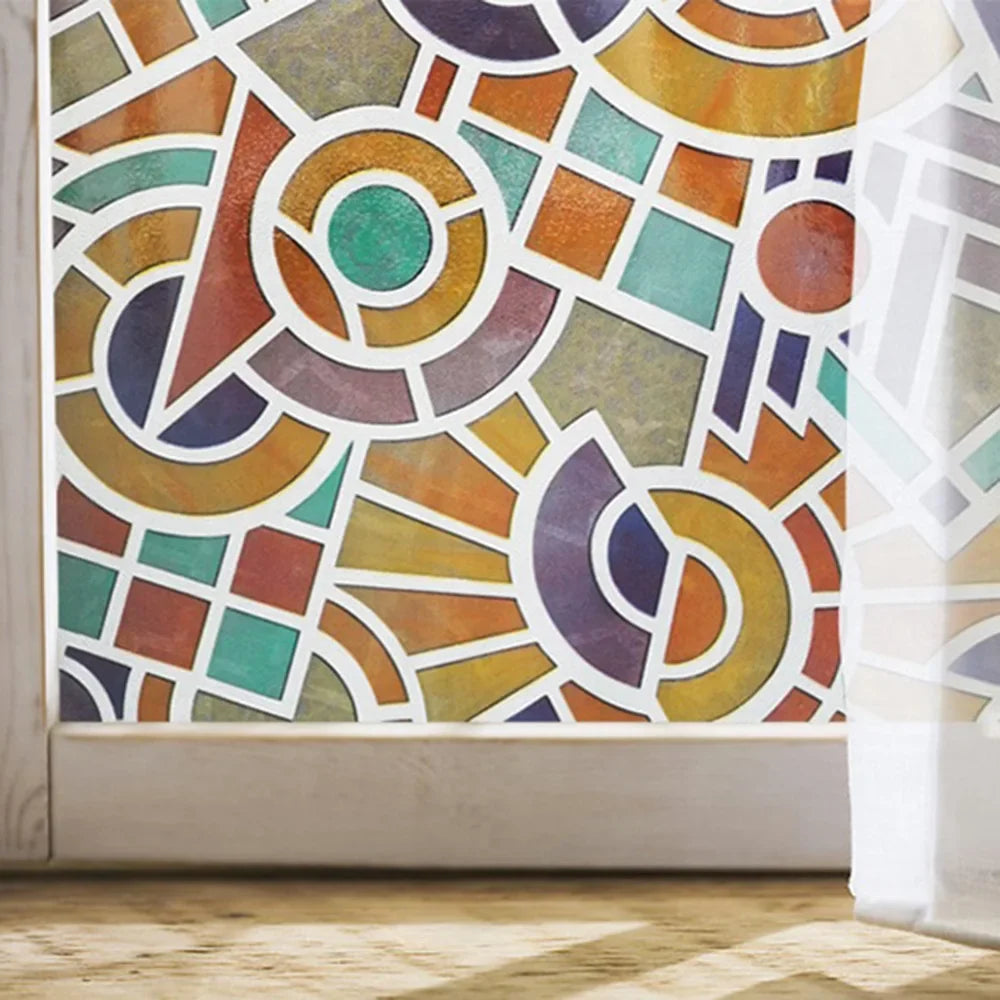 A close-up of frosted stripe privacy window film featuring an abstract geometric pattern in earthy tones.