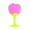A pink fruit teether and rattle set with a yellow silicone grip for babies.