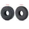 Two black Monster truck tires, one M 64mm and one N 65mm, shown from the side.
