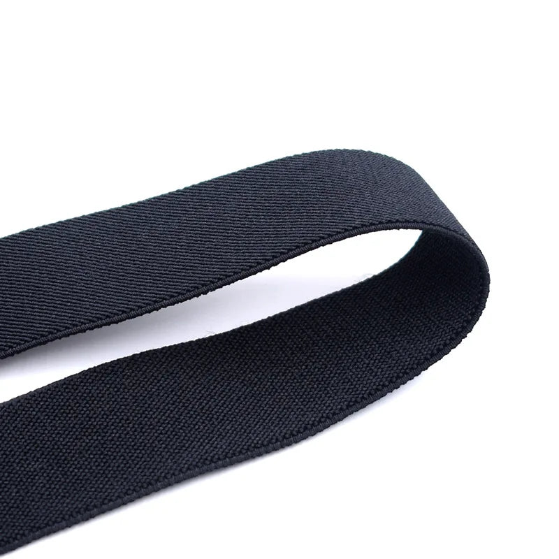 Black fabric suspenders with metal clips shown flat against a white background.