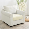 A cream-colored plush velvet stretch sofa seat cover with vertical stripes sits on a light wood floor.