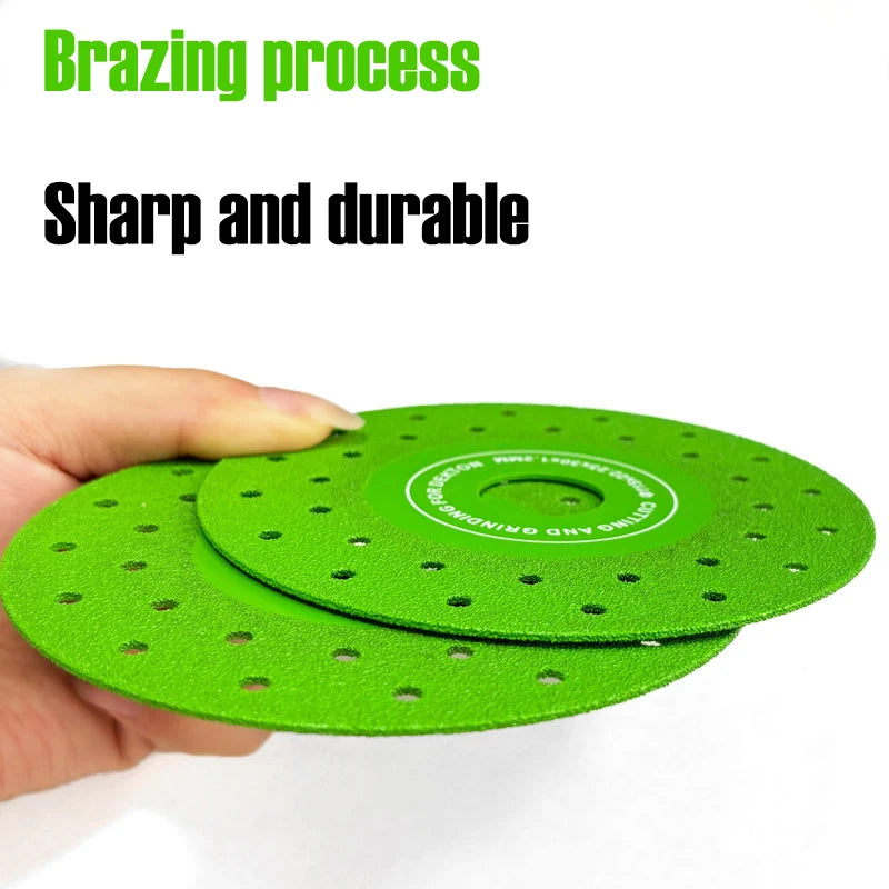 A hand holds a bright green diamond cutting and grinding blade with small holes for tile, stone, and glass.