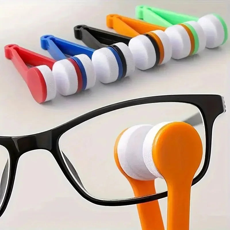 A set of five colored cleaning tools for eyeglasses, including microfiber cloths and brushes.