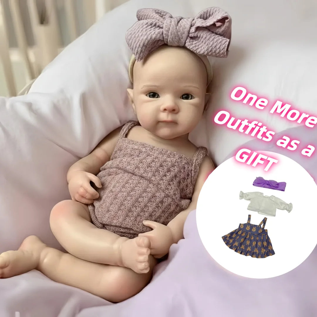 A baby reborn silicone doll wearing a knitted outfit and a bow headband, presented as a gift.