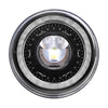 A close-up view of a 7-inch round LED headlight with a DRL halo and amber turn signal.