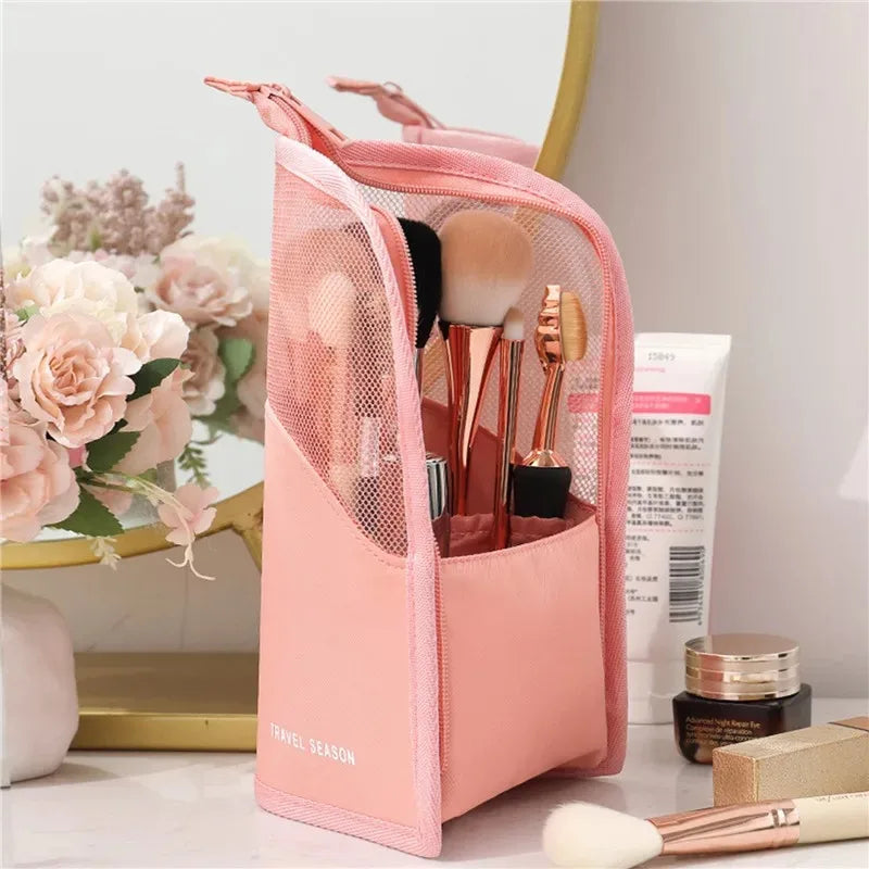 Pink waterproof makeup brush holder with a foldable stand and brushes