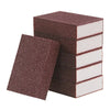 A stack of dark brown Emery cleaning sponges for stubborn stains.