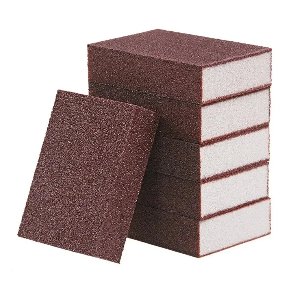 A stack of dark brown Emery cleaning sponges for stubborn stains.