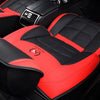 Red and black quilted car seat covers for a Chevrolet model interior.