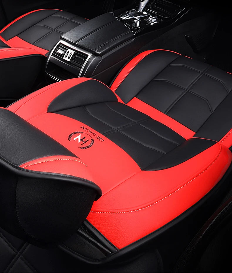 Red and black quilted car seat covers for a Chevrolet model interior.