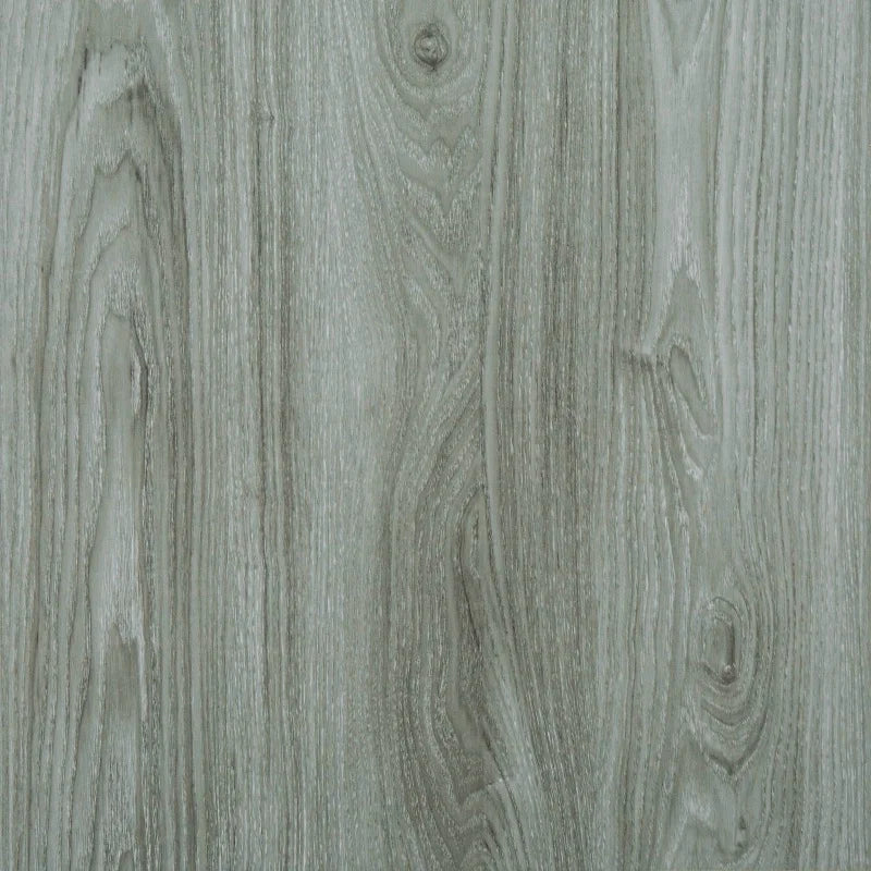 Close-up view of gray wood grain vinyl flooring tiles with visible natural texture and linear patterns.