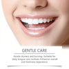 Close-up of a person's mouth showing bright white teeth and gums, demonstrating gentle oral care.