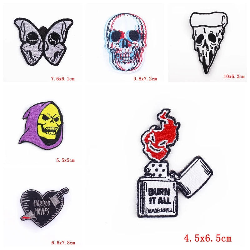 A set of ten embroidered iron-on patches featuring various skull and horror designs in black, purple, and red.