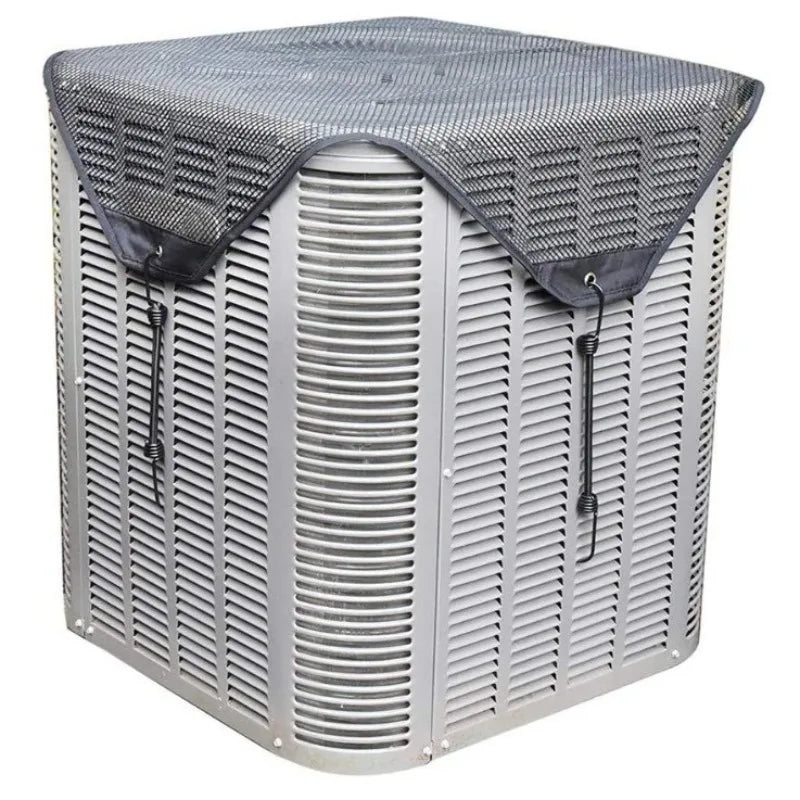 A silver outdoor AC unit is covered with a breathable black mesh protective cover.
