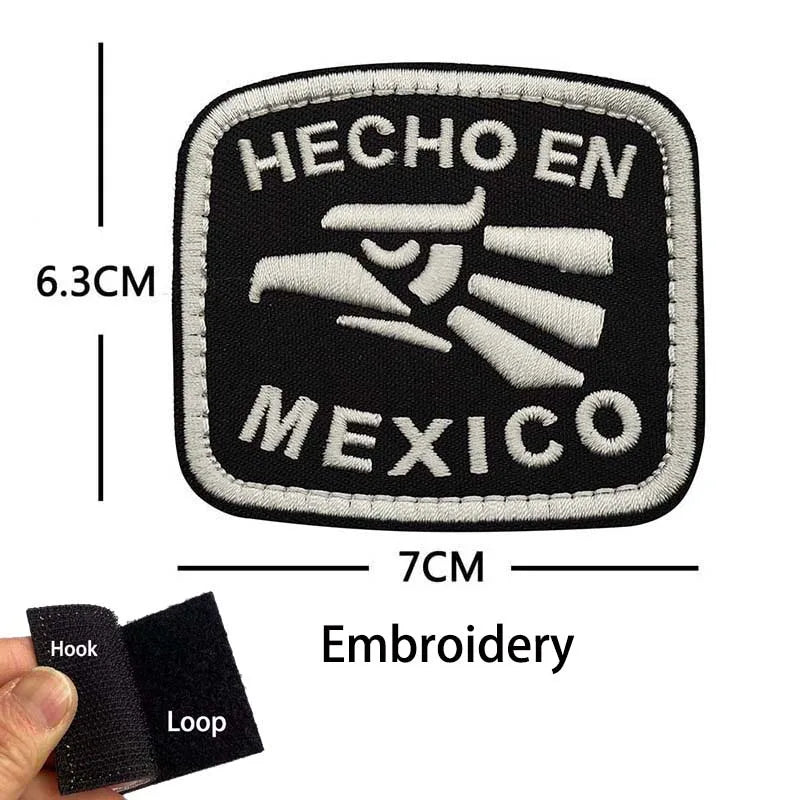 Black embroidered patch featuring the text HECHO EN MEXICO and an eagle skull design with hook and loop backing.