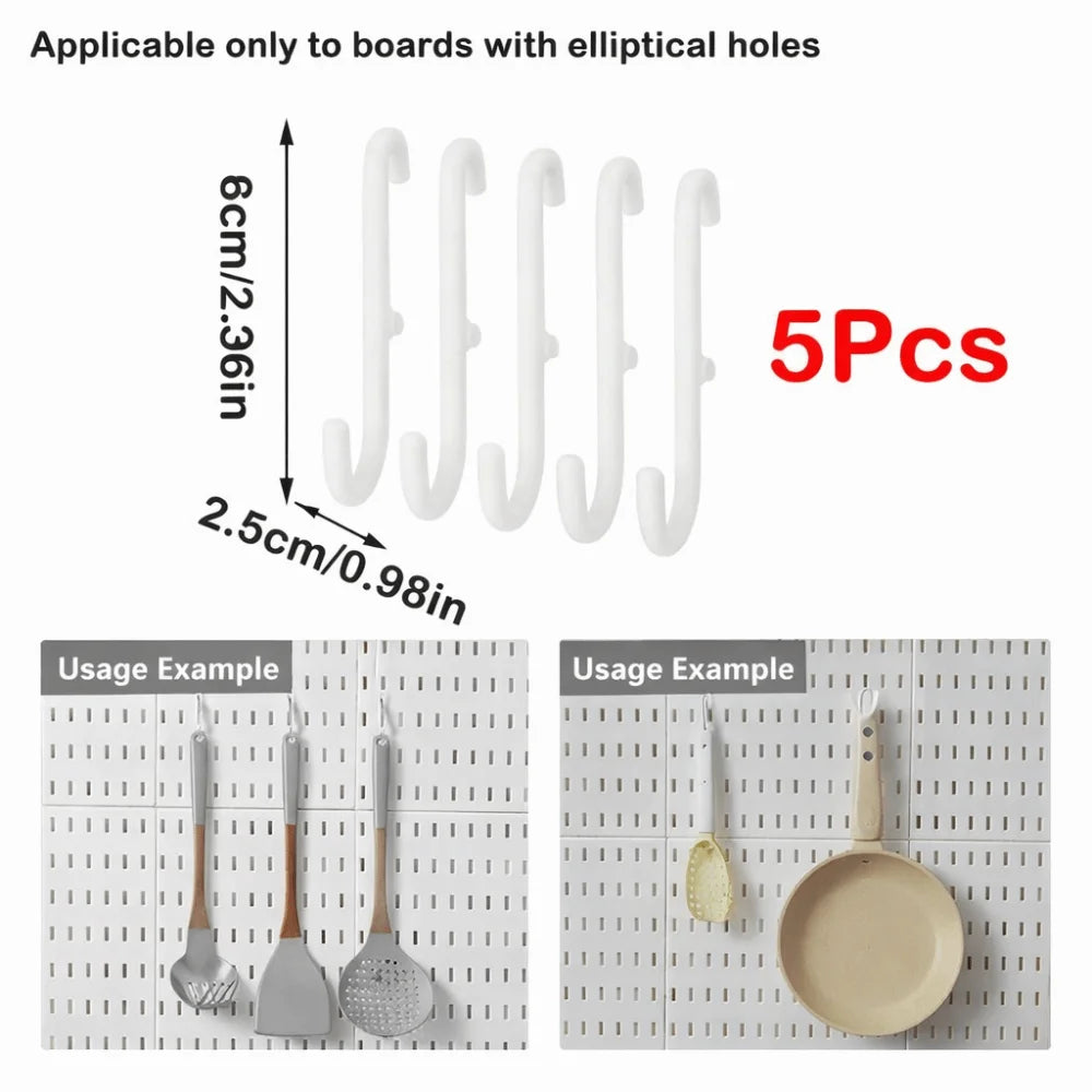 Five white wall-mounted hooks with elliptical holes, measuring 6cm long.