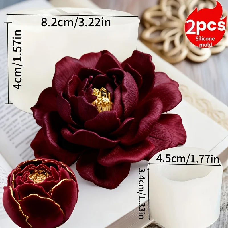 A deep burgundy lotus flower silicone mold resting on a white surface with loose silicone strands nearby.