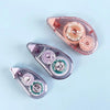 Three rolls of pink and purple double-sided adhesive tape for crafts and office use