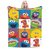 A colorful flannel throw blanket featuring characters from Sesame Street