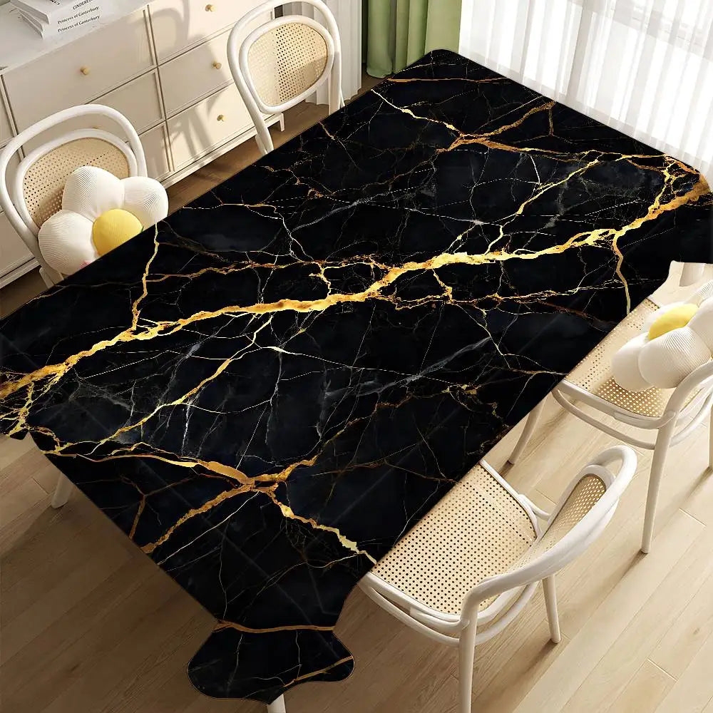 Black gold marble waterproof tablecloth displayed on a wooden floor with white chairs and natural light.