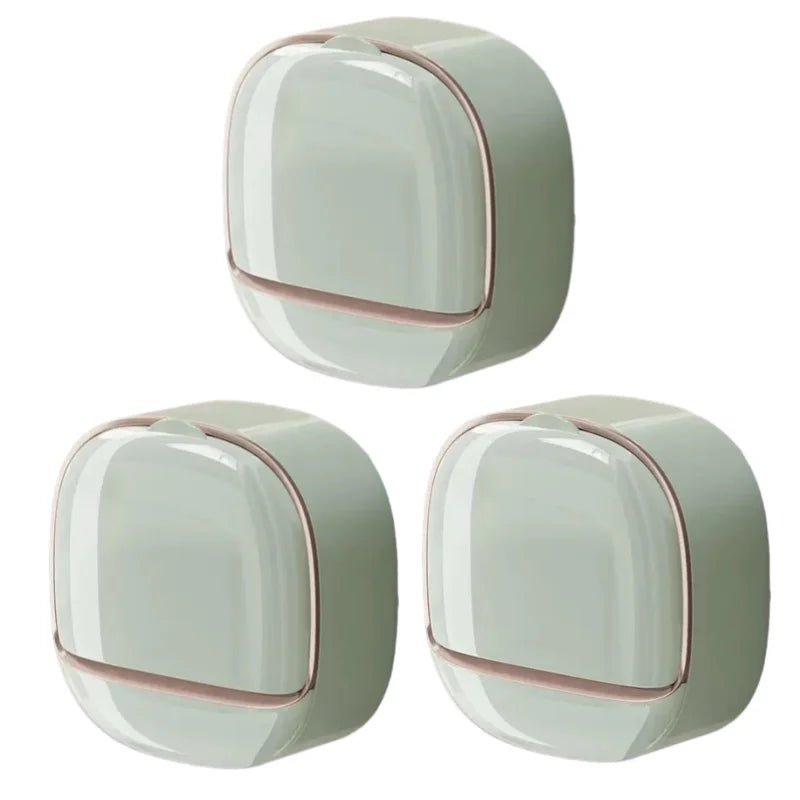 A pair of modern, light green waterproof hanging soap holders with drainage features.