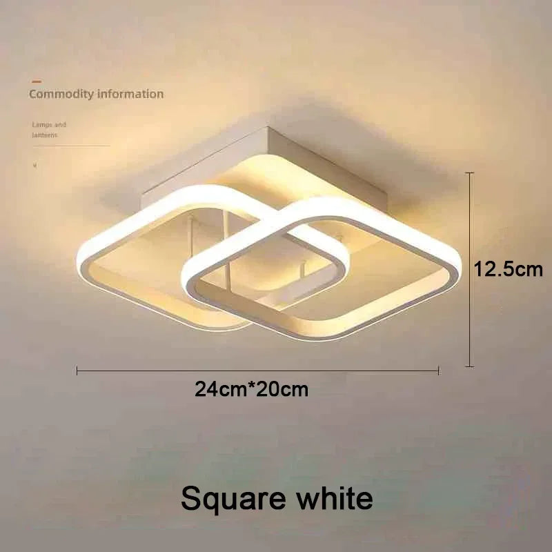 A square white modern LED ceiling light fixture with a clover shape design.