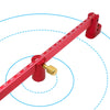A red aluminum circle drawing ruler and center finder with markings and a brass finder tip, shown against a blue circular gui
