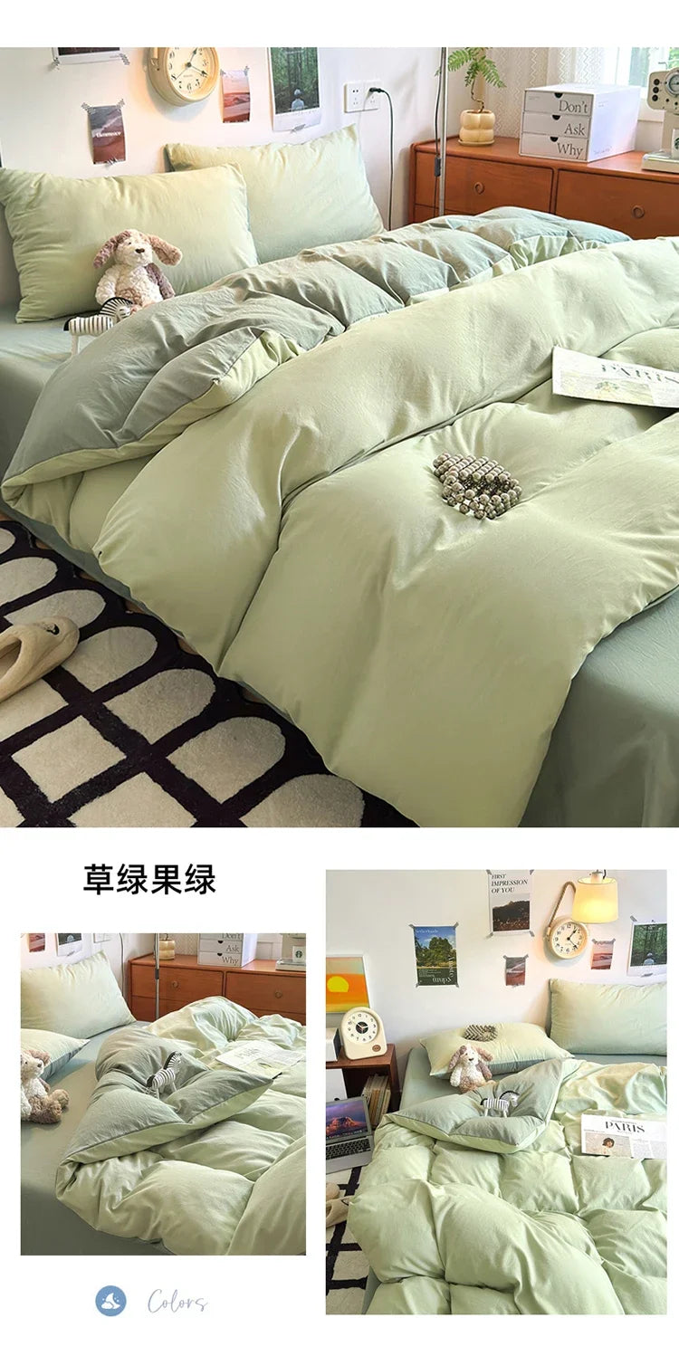A set of four ultra-soft washed cotton duvet covers in a pale sage green color displayed on a bed.