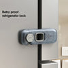 A baby proof refrigerator lock installed on a silver appliance door.