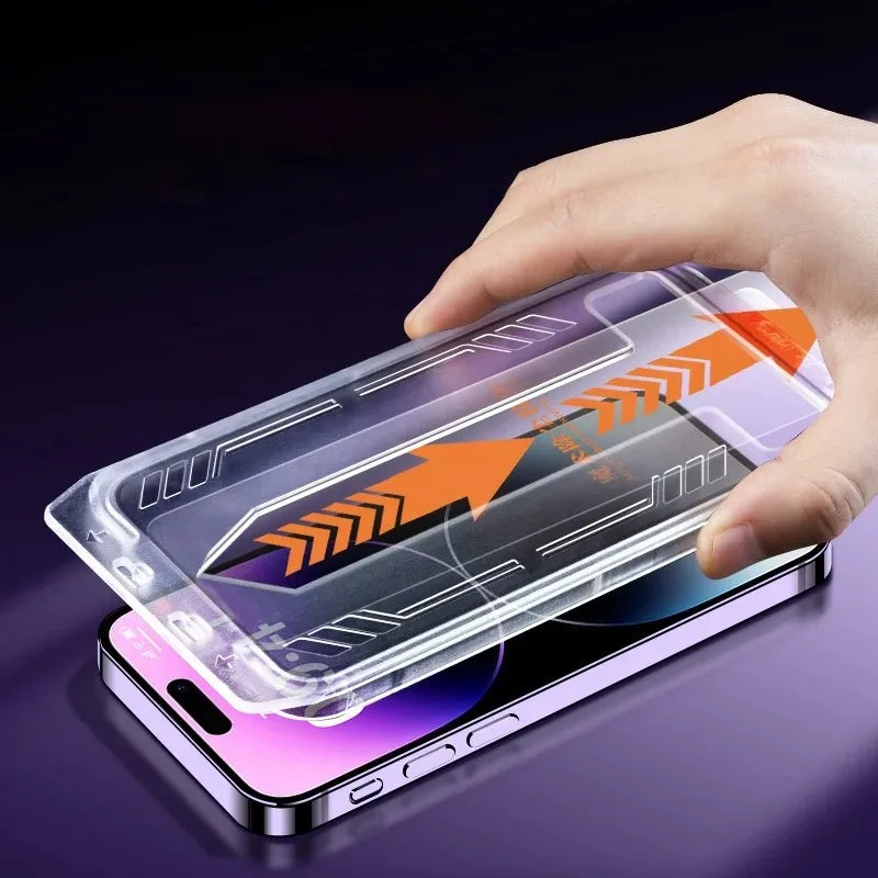 A hand holds a smartphone with a clear privacy screen protector applied, showing an orange arrow design.
