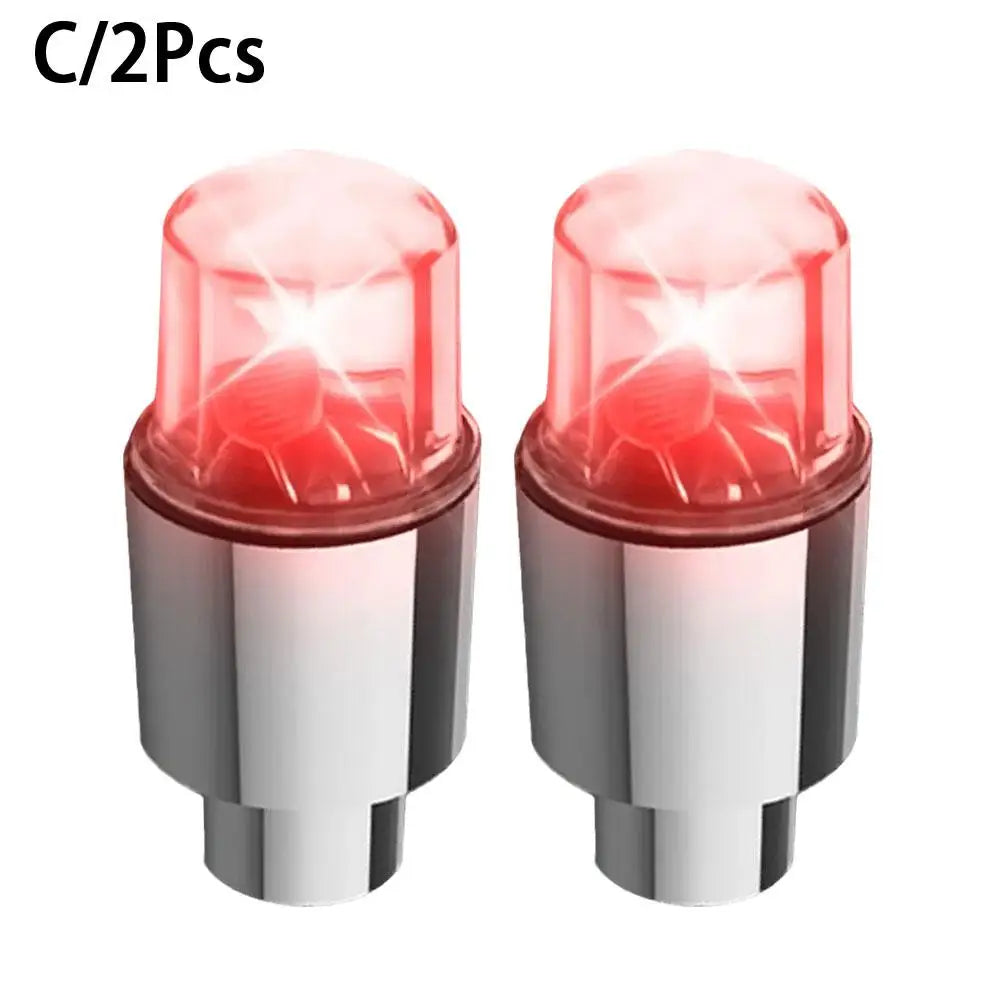 A pair of motion-activated LED tire valve lights for bikes, cars, and motorcycles.