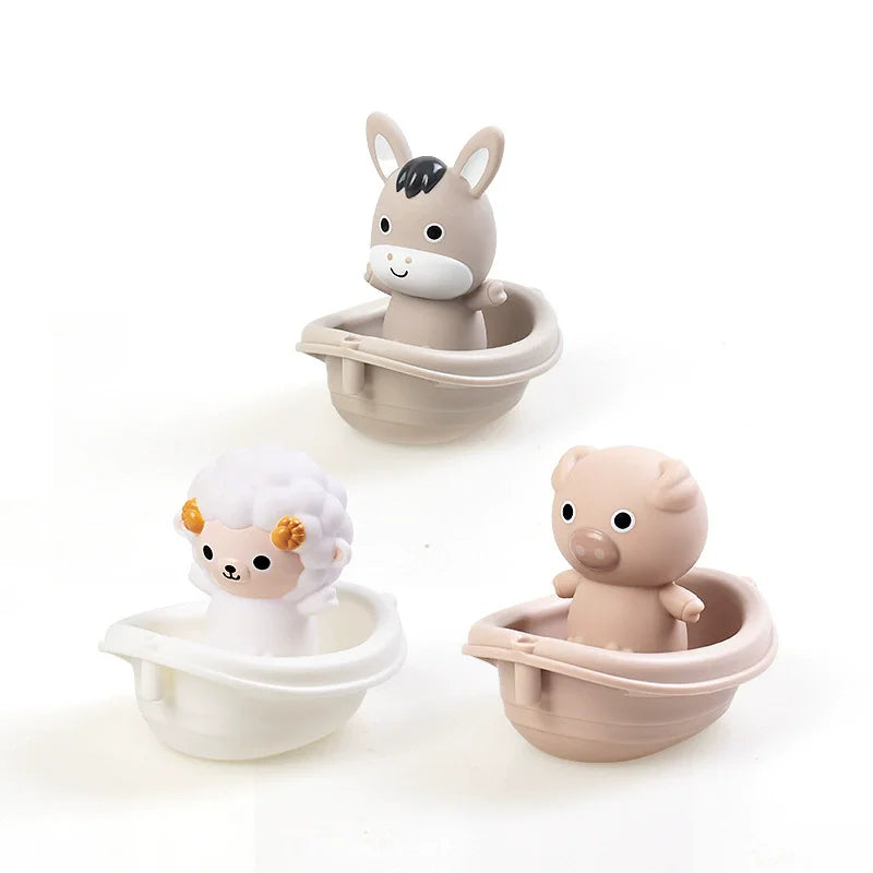 A set of silicone animal finger puppets, including a donkey and a pig, designed as bath toys for toddlers.
