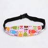 Pink and green patterned adjustable baby car seat sleeping headrest with a black belt strap