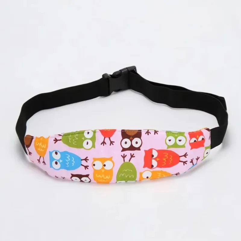 Pink and green patterned adjustable baby car seat sleeping headrest with a black belt strap