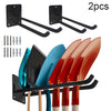 Two black wall-mounted racks and five colorful garden tools are displayed.