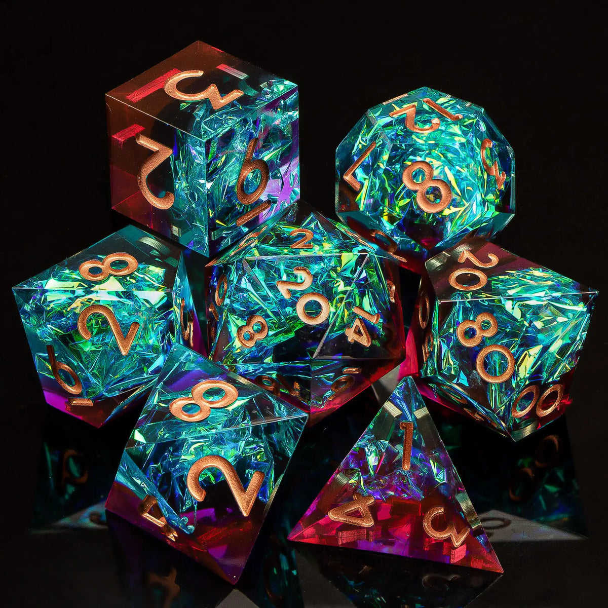 A collection of glossy, multi-colored resin polyhedral dice, including a d20 and a tetrahedron, displayed on a dark surface.