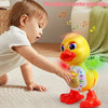 A baby is interacting with a yellow, interactive dancing duck toy that emits lights and music.