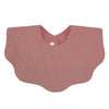 A soft pink cotton baby bib in a bandana style with a textured surface.