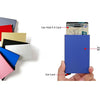 A blue slim metal RFID blocking card holder with a pop-up design is shown next to various colored cards.