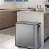 A stainless steel double trash can with a soft-close lid sitting on a kitchen countertop.