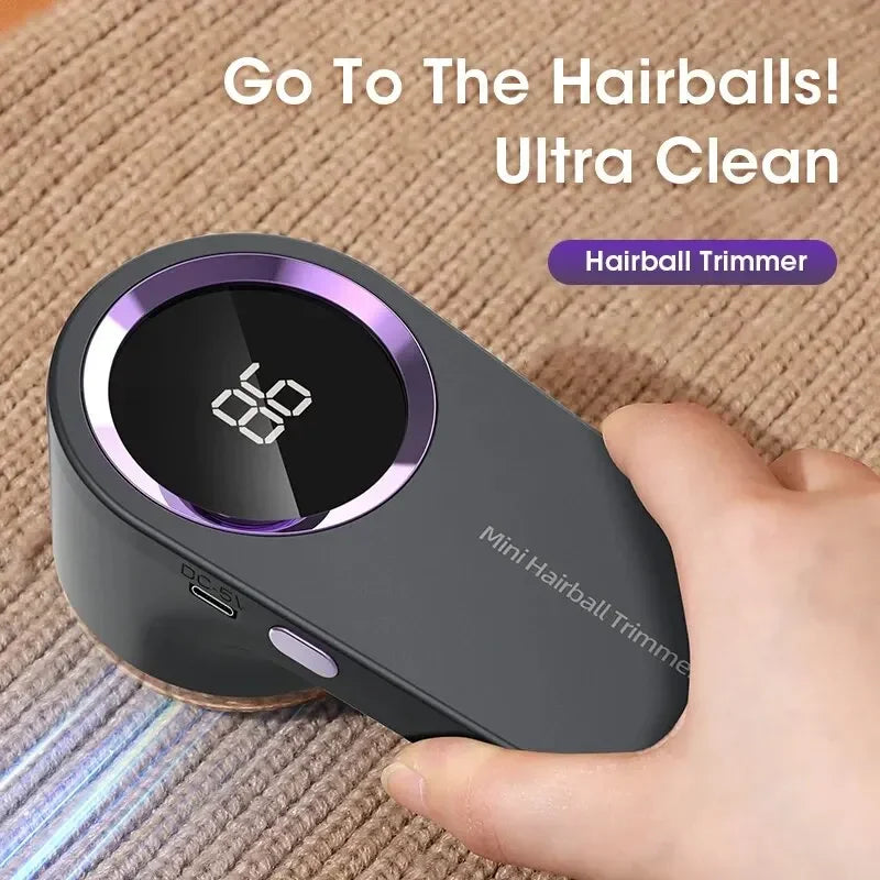 A hand holds a Mini Hairball Trimmer device with a digital display, demonstrating the ultra clean feature.