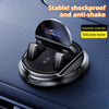 A black silicone anti-shake phone mount with an automatic snap lock is shown mounted on a dark car dashboard.