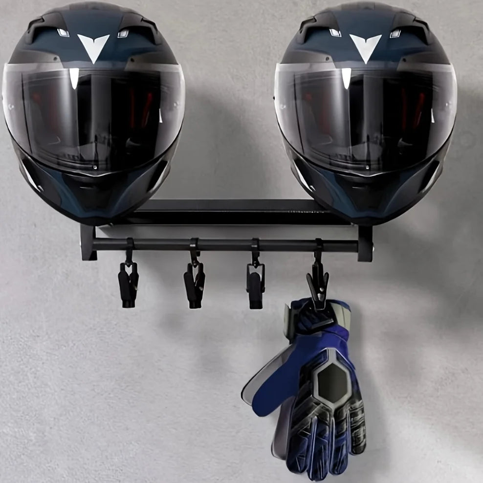 A pair of black motorcycle helmets are displayed on a wooden wall mount shelf.