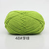 A ball of bright lime green 4-ply milk cotton yarn for knitting and crochet.
