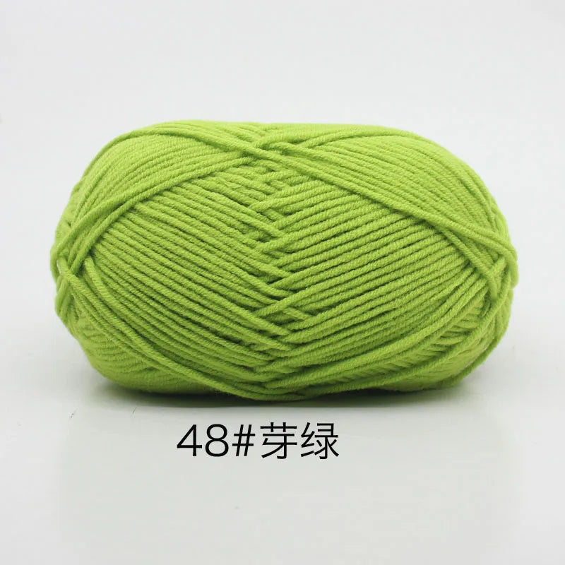 A ball of bright lime green 4-ply milk cotton yarn for knitting and crochet.