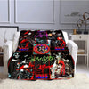 A black and red printed flannel throw blanket featuring the Kiss band logo and artwork.